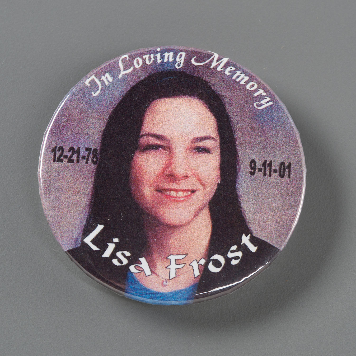 Photo: A memorial button commemorating Lisa Anne Frost who was on Flight 175 on September 11, 2001.