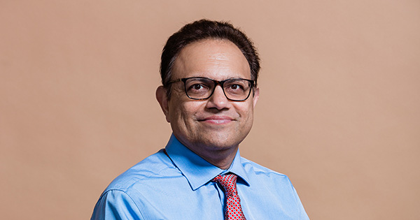 Photo: Arun Upneja poses for a formal headshot portrait