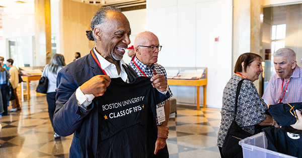 Boston University Golden Terrier Harold DuFour-Anderson (COM‚’75), (SED‚’78) pics out his Class of ‚Äô75 shirt at brunch at the Golden Terriers Celebration at the Howard Thurman Center on Saturday, September 27, 2025. Photo by Jake Belcher for Boston University Photography.