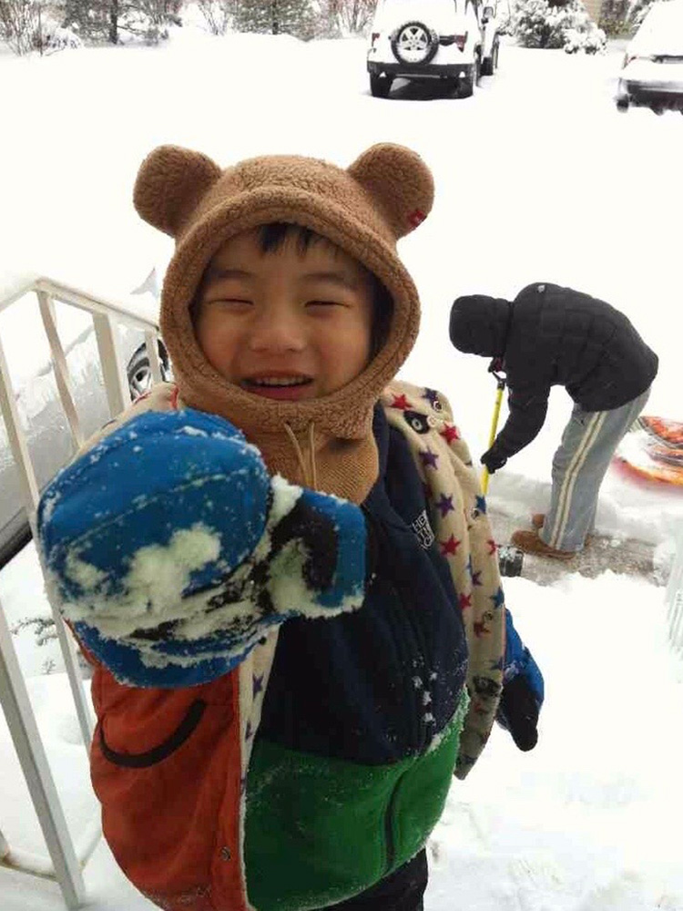 Photo: Ryan Sim as a small child playing outside on a snowy day