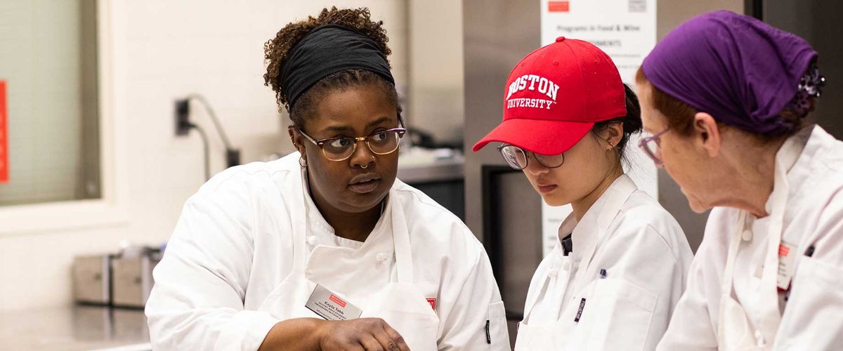 Kayla Tabb talking with students in Pastry Arts Program at Boston University.