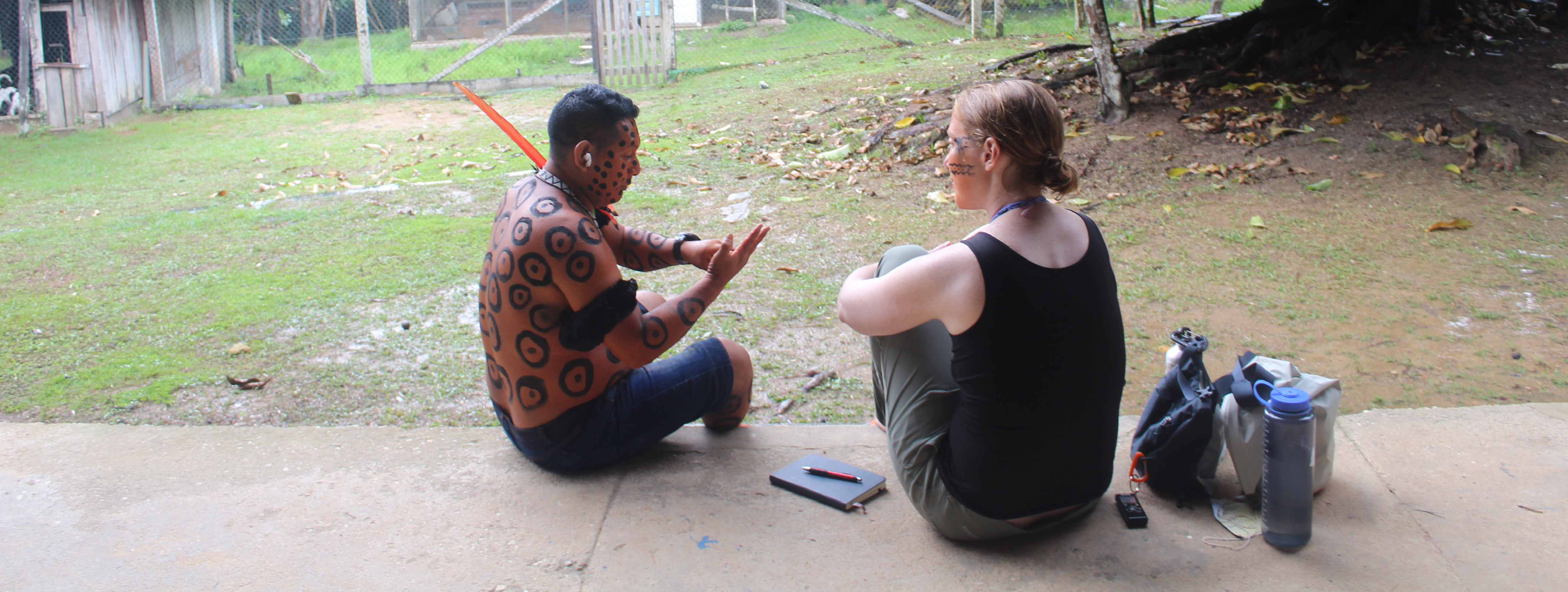 Professor Julie Klinger sitting with a Yanomami individual