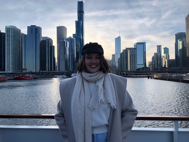 Adriane Vigna in front of city skyline