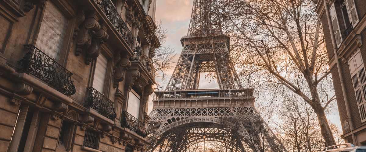 view of eiffel tower from Paris street