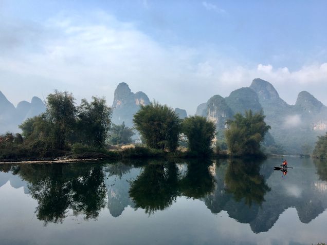 2018 GP Photo Contest 1st place winner a man in a boat on a picturesque lake in Guilin China