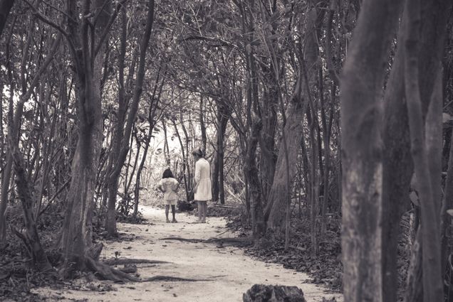 2015 GP Photo Contest Finalist a woman and child on a sandy trail in a forest