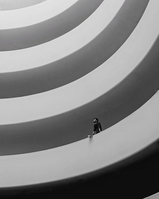 2020 GP Photo Contest Finalist man stnading inside the gugenheim museum looking into the spiral ramp.