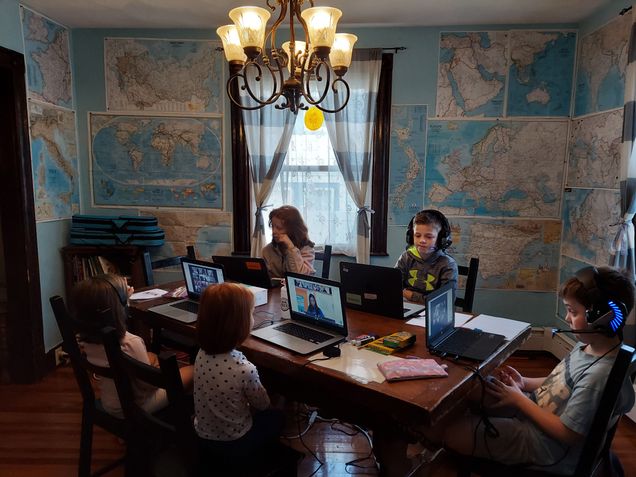 2021 GP Photo Contest 2nd Place winner children sitting at a diningroom table going to remote school