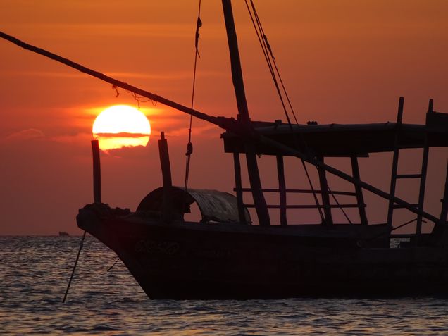 2016 GP Photo Contest Finalist anchored work boat at sunset in Zanzibar