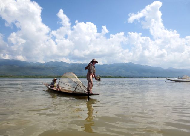2013 GP Photo Contest Finalist fisherman on his boat on a river in asia