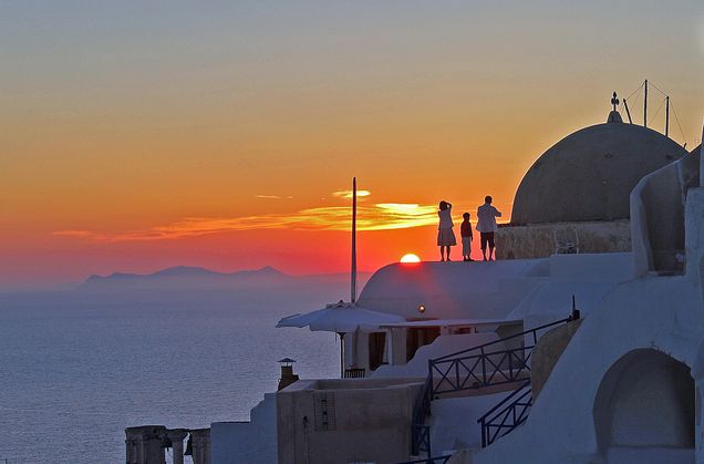 2013 GP Photo Contest Finalist pwople standing on a roof in Greece at sunset