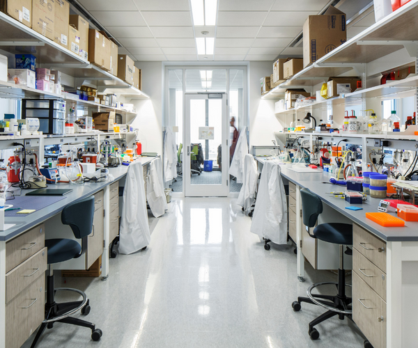 A university lab with a variety of scientific equipment on the desks.