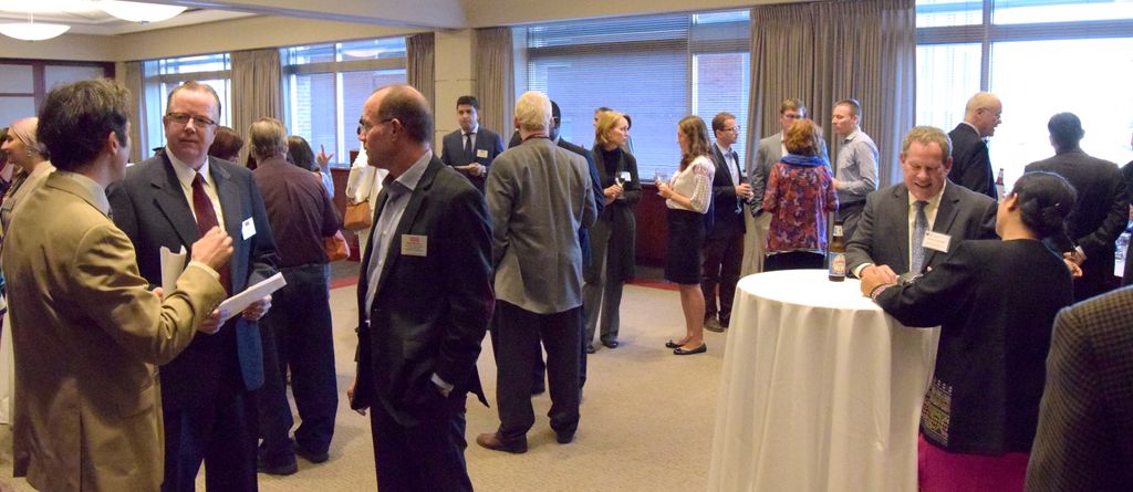 Fellows, faculty advisors, affiliate partners, host families, and other friends of the Program enjoying the reception together