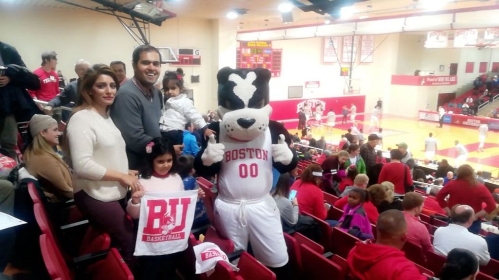 Waqas Munir of Pakistan and his family with Rhett the BU mascot