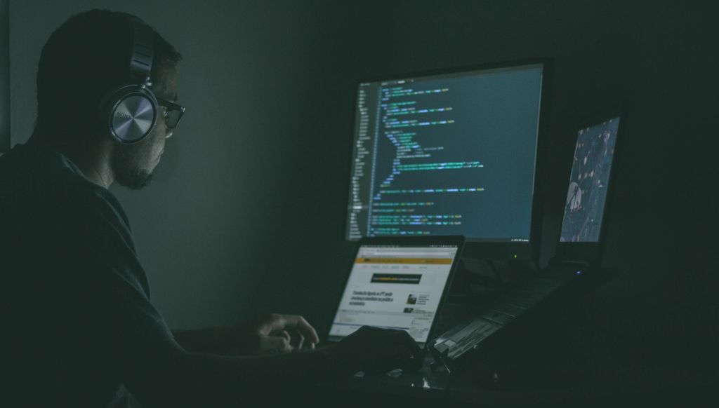 criminal sitting at computer