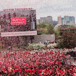Photo: A wide shot of Nickerson Filed with confetti flying in the air. The large video board reads BOSTON UNIVERSITY CONGRATULATIONS GRADUATES!