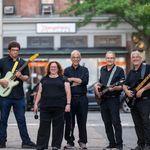 Photo: The band Ronona J posing on the streets of Natick
