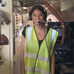 Photo: A BU student in a safety vest and headset at NASA