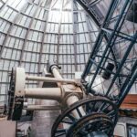 Photo: Interior of the Perkins Telescope Observatory in Flagstaff, Arizona. An enormous telescope is shown inside a large, steel framed-dome.