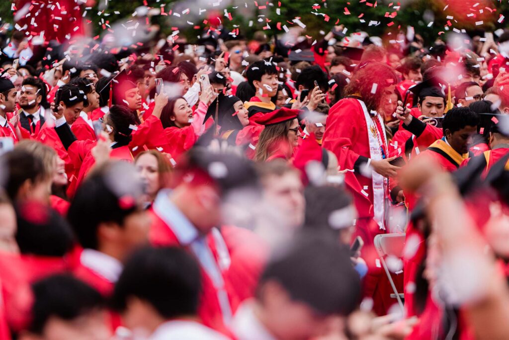 Photo: A sea of red gowns and confetti in this scene from Boston University's 2024 commencement
