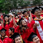 Photo: College students in red robes and caps celebrate at Boston Universitys 152nd commencement in 2025