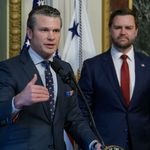 Photo: Pete Hegseth at a podium with VP JD Vance behind him