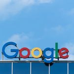 Photo: "Google" logo sign with colorful letters on top of a building