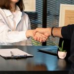 Photo: Stock image of two people shaking hands in mock interview.
