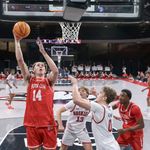 Photo: The BU men's basketball team playing on the court during a game