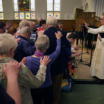 Photo: A church full of people during a busy sunday worship at a methodist service