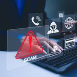 Photo: Scam icons coming out of a computer