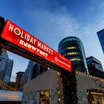 Photo: The Holday Market at Snowport with a sign leading to the entrance