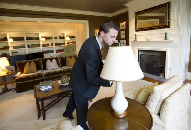 Sam Everett (SHA'11) does a walk-through at the Presidential Suite in the Four Seasons where he is a Housekeeping Supervisor. August 19, 2011. Photo by Cydney Scott for Boston University Photography