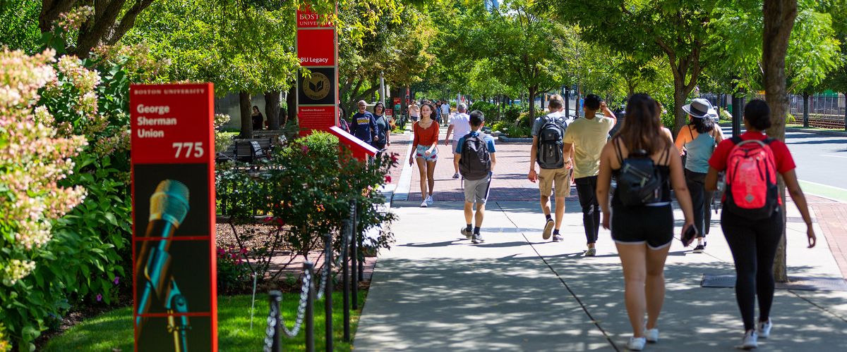 photo of student walking thru out campus