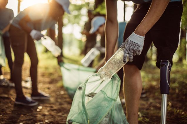 People picking up trash outside