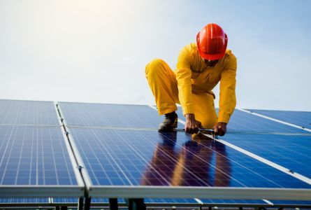 Technician checks the maintenance of solar panels