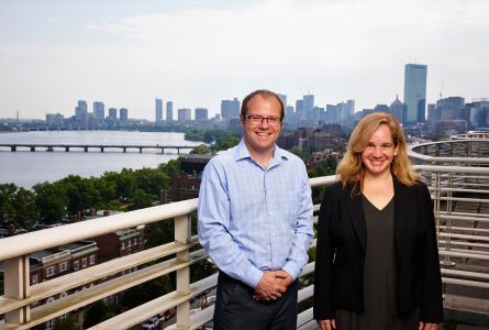 Benjamin Sovacool and Rebecca Pearl-Martinez with Boston cityscape in background