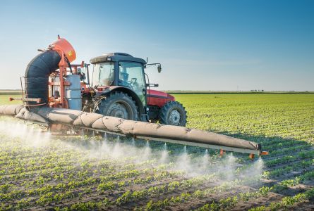 Tractor spraying pesticides