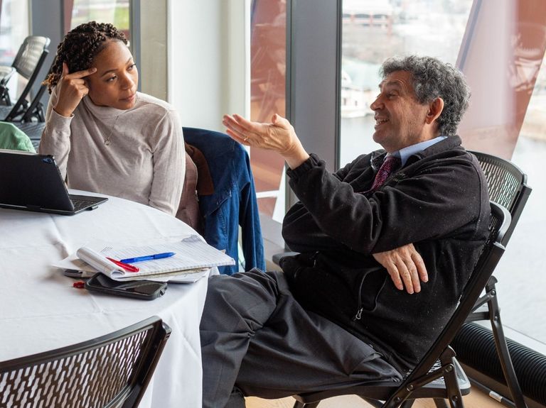 Two professionals having a conversation.