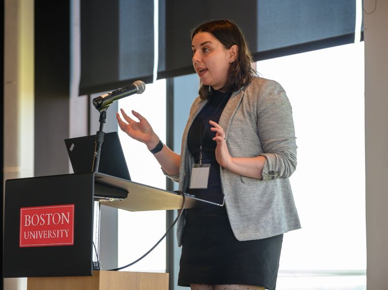 Professional speaking at a podium.