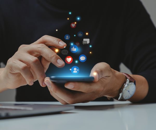 Person scrolling social media on phone.