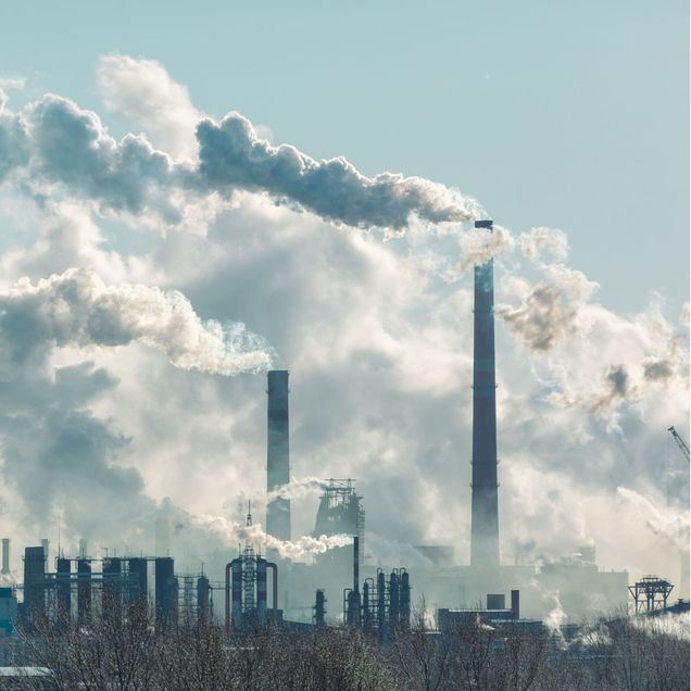 A city with factory pollution and smokestacks.