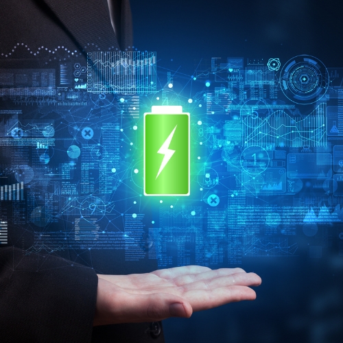 A green battery hovering above a hand with a blue background.
