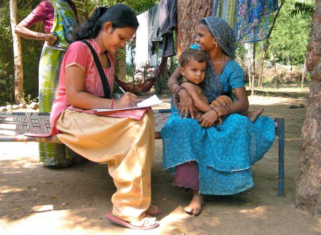An interviewer conducting a survey in sim-vistar of Padgol village