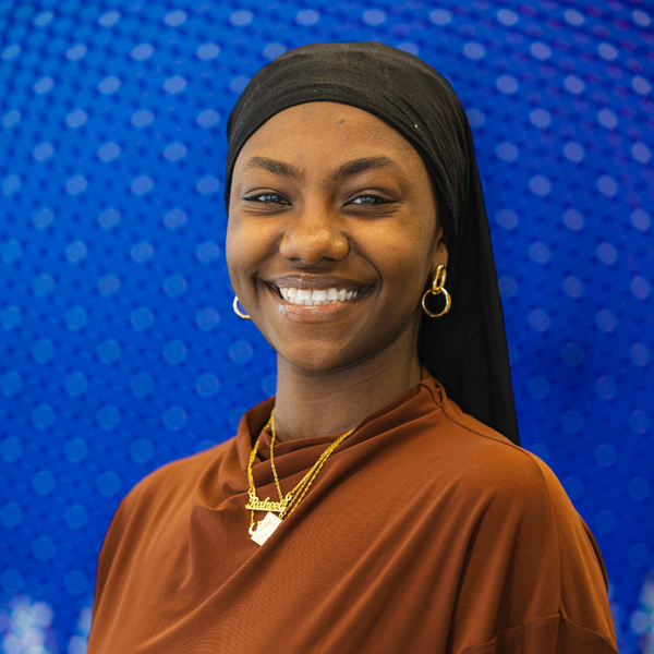 Raheeq smiling for headshot