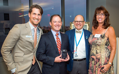 From left to right: John Koss (’05), chair of Fenway Health Board of Directors, Hon. David Breen, Stephen Boswell, MD, president and CEO of Fenway Health, and Randy Tye O’Brien.