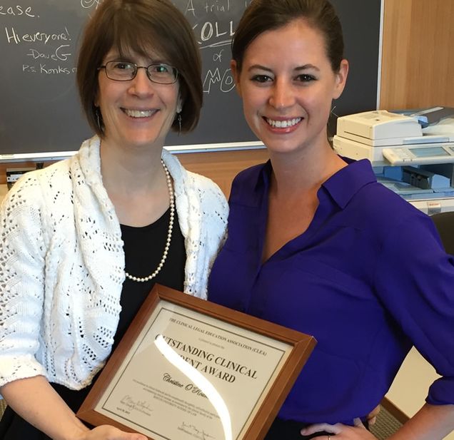 Dean Maureen O'Rourke awards Christine O'Rourke ('15) (no relation) the Clinical Legal Education Award for the Outstanding Clinical Student.