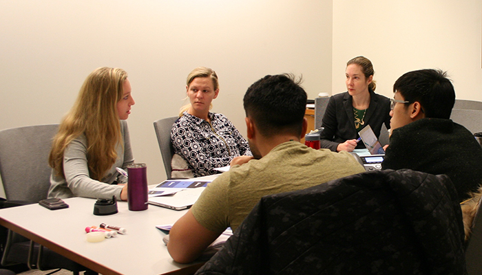 The BU Spark! team meets with members of BU Law's Immigrants' Rights & Human Trafficking Program to collaborate on an app to help identify victims of labor trafficking.