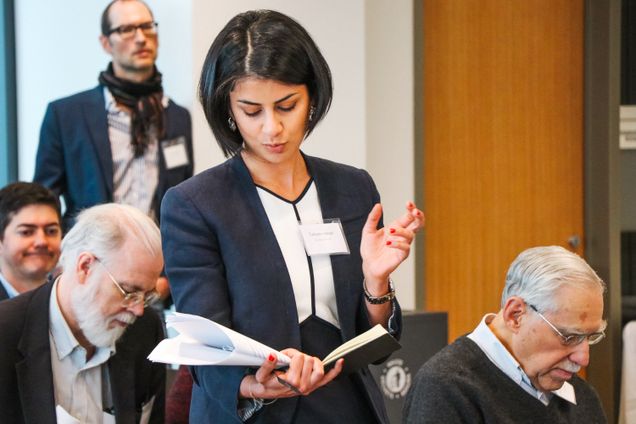 A woman from the panel standing up and speaking