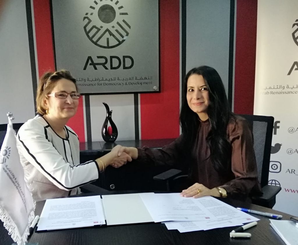 Samar Muhareb and Susan Akram shaking hands